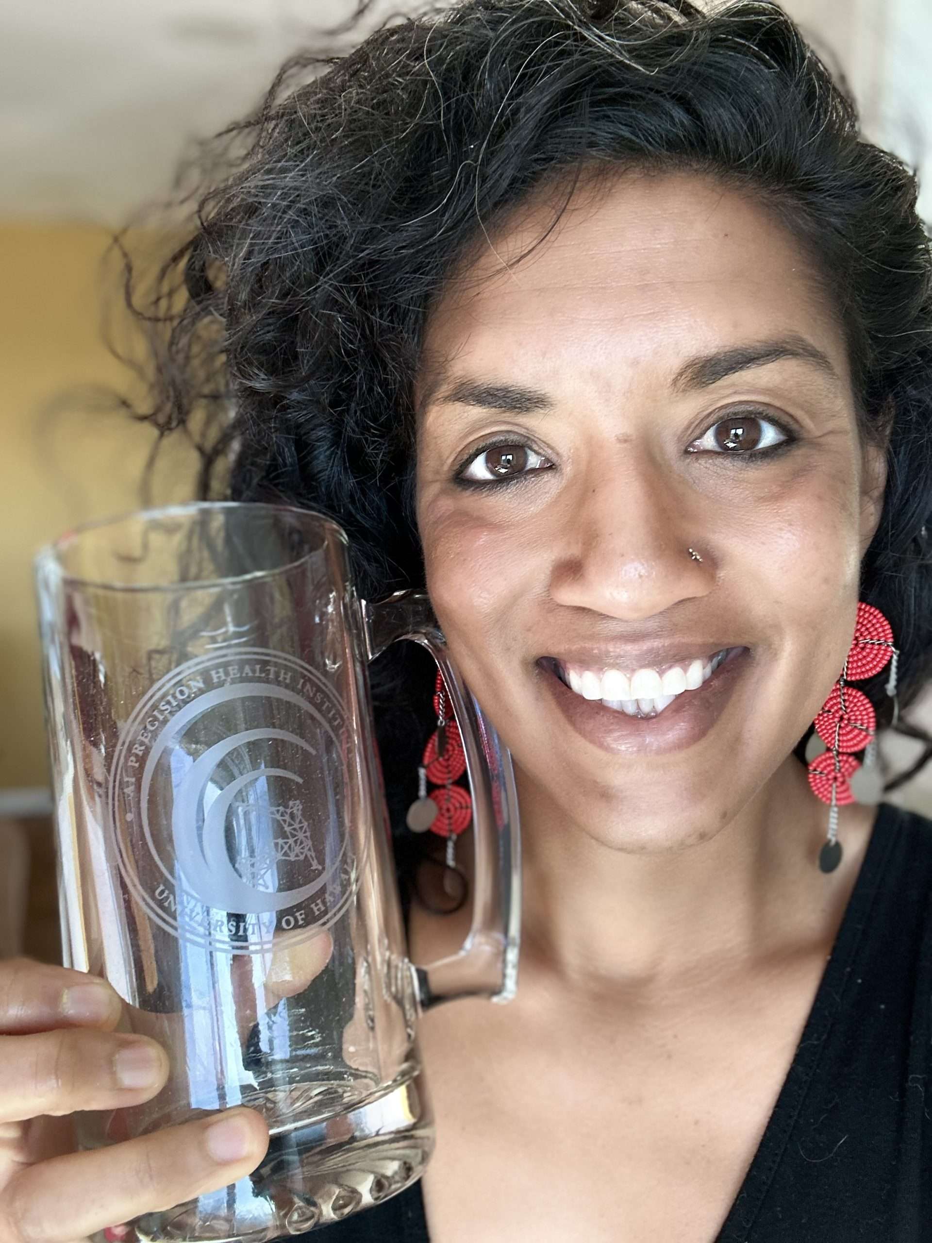 Aekta Shah with their PAC-AID beer stein