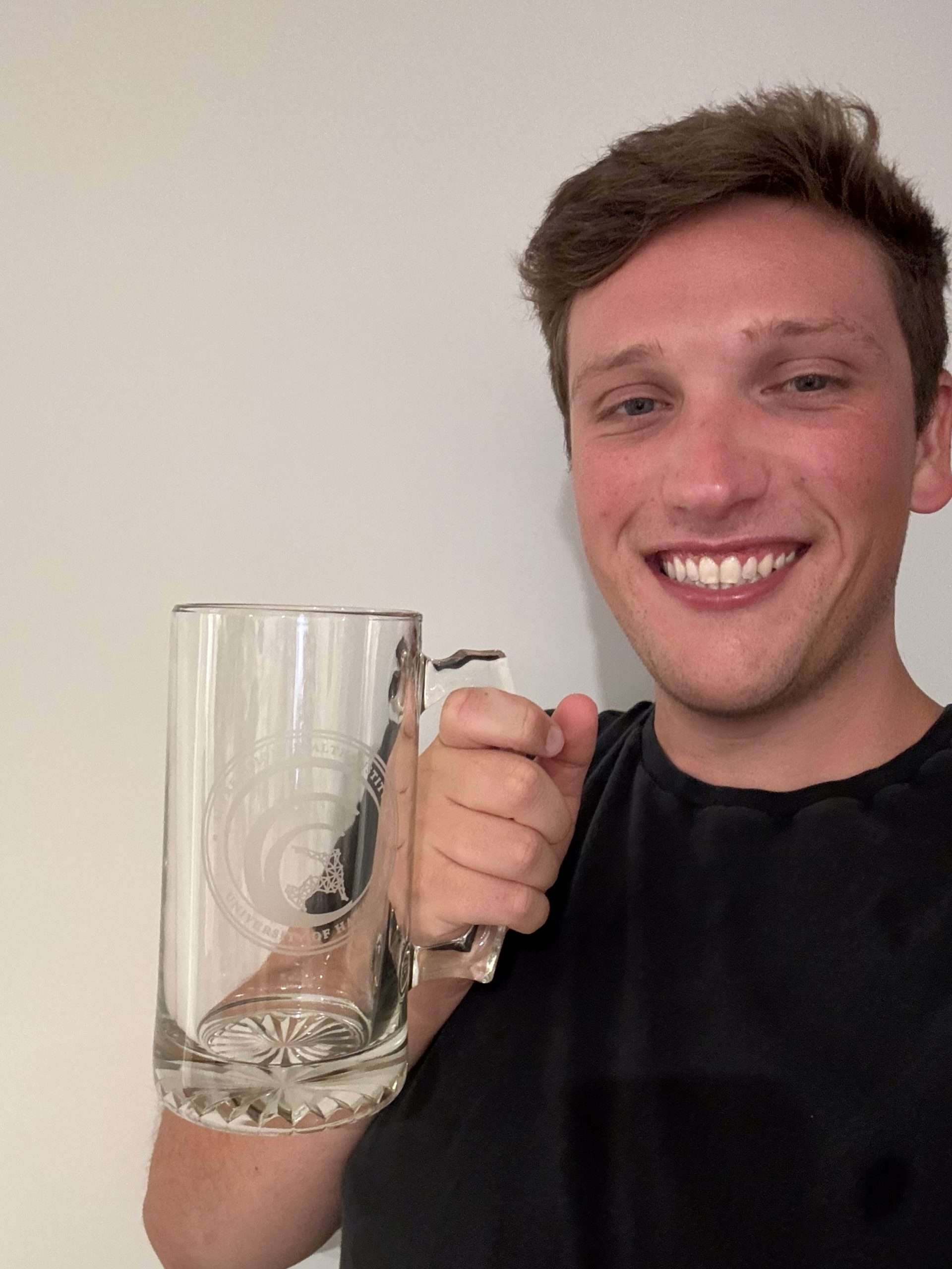 William Rudman with their PAC-AID beer stein
