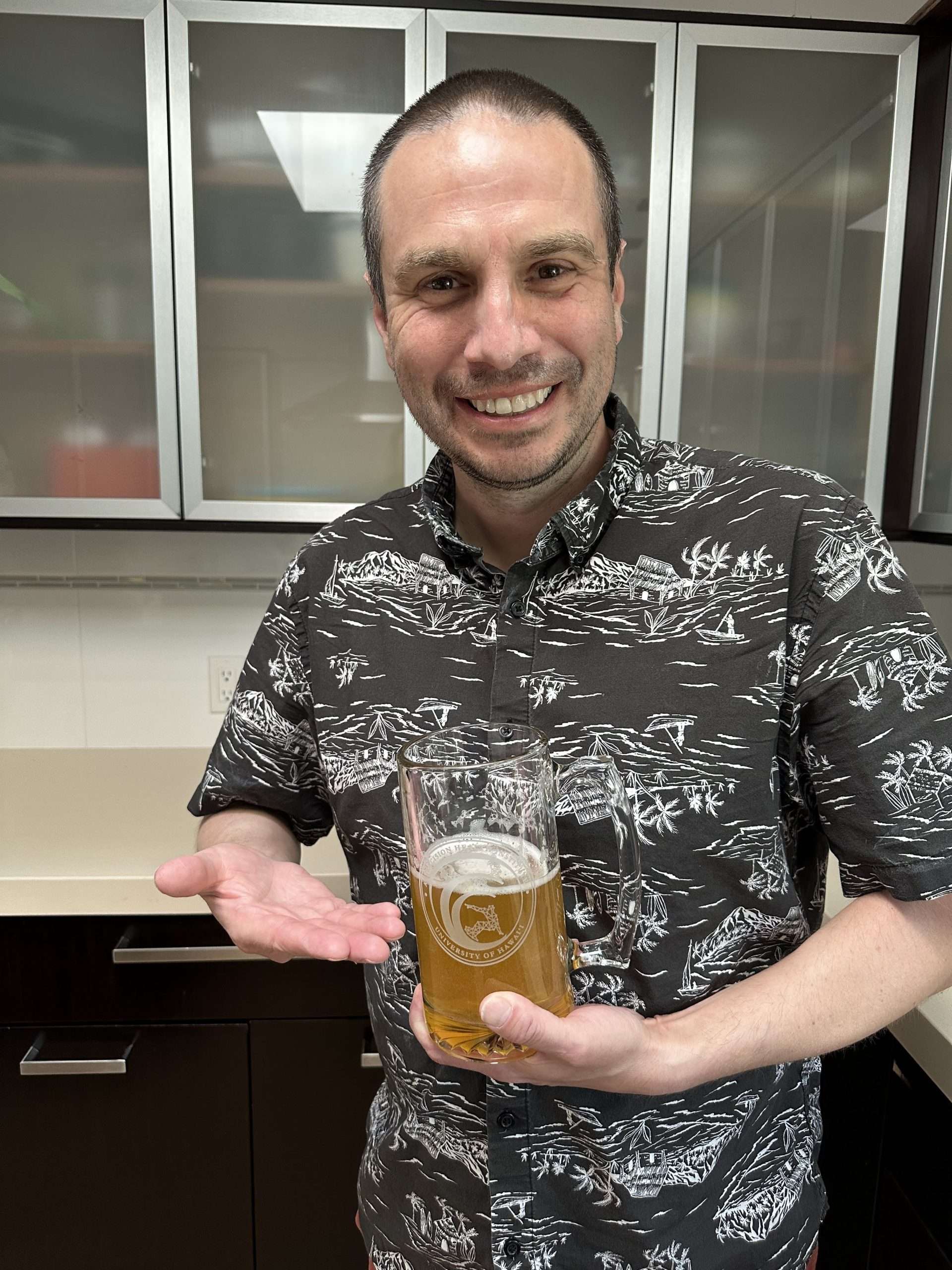 Rory Sayres with their PAC-AID beer stein